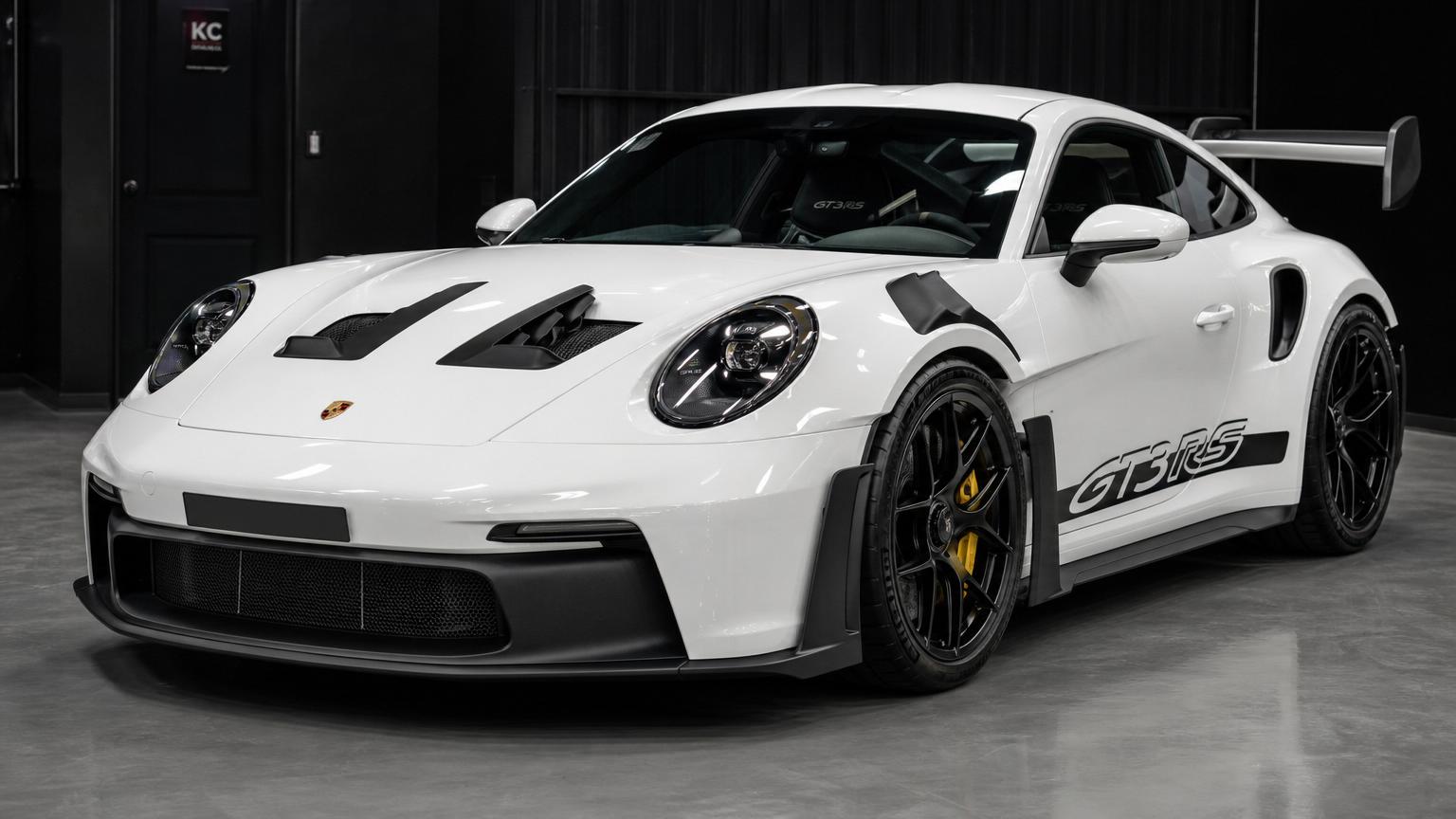White Porsche 911 GT3 RS after professional detailing with mirror-like gloss
